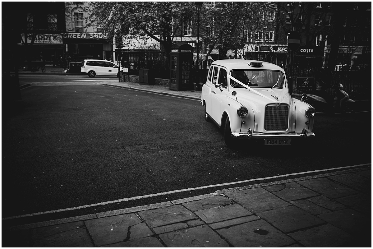 taxi arriving at Union Chapel wedding