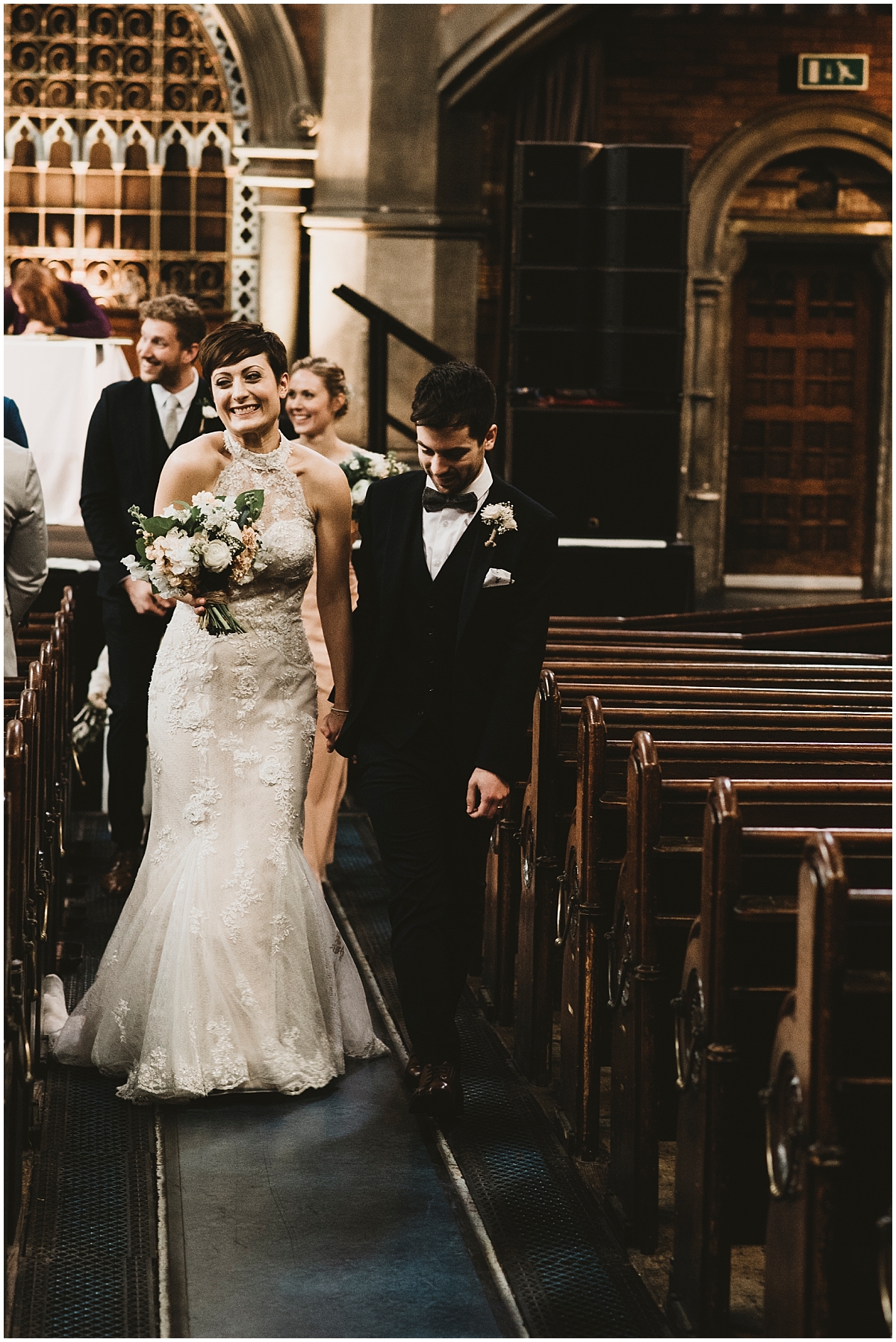 bride and groom coming down isle at Union Chapel wedding