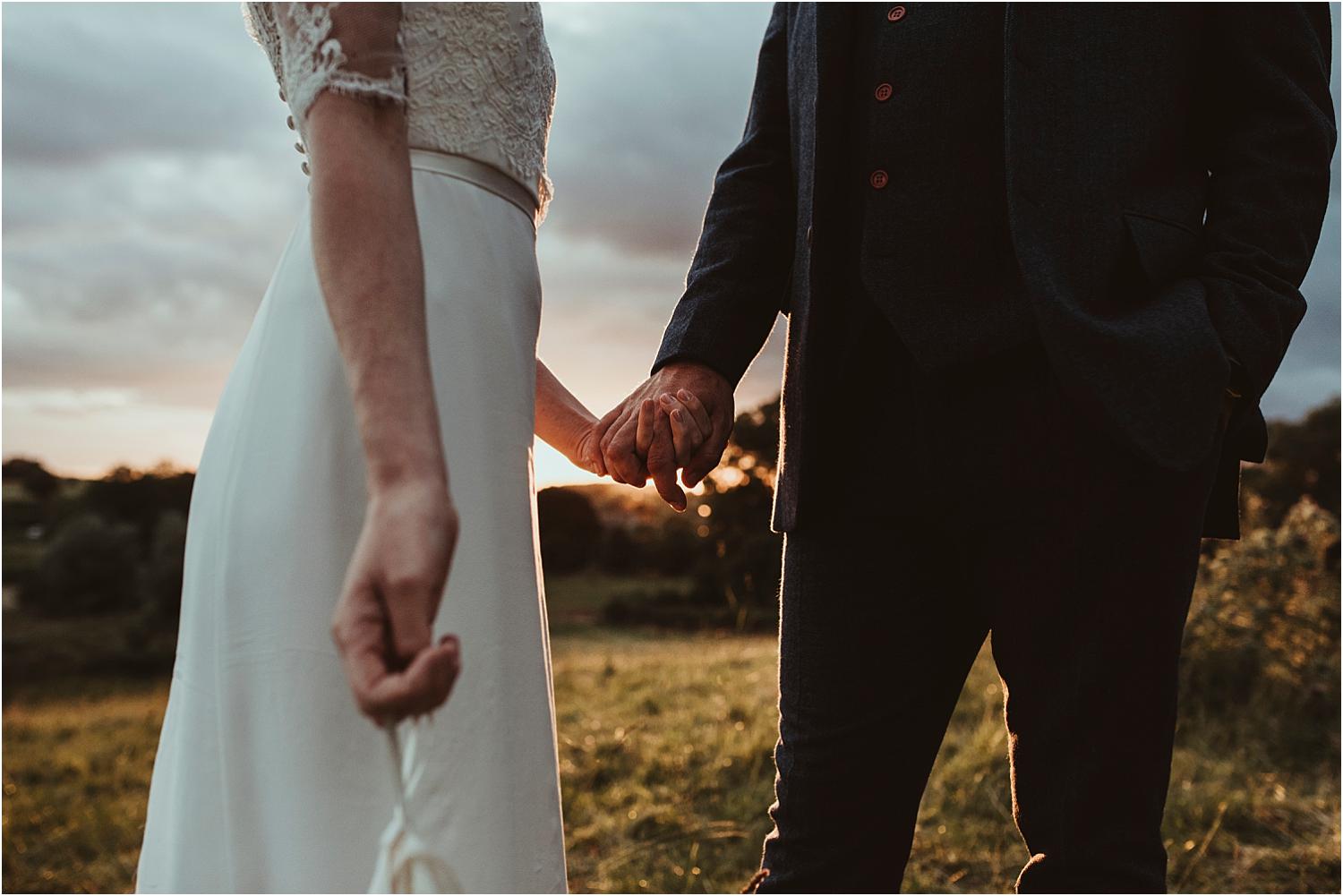 holding hands at a festival themed wedding