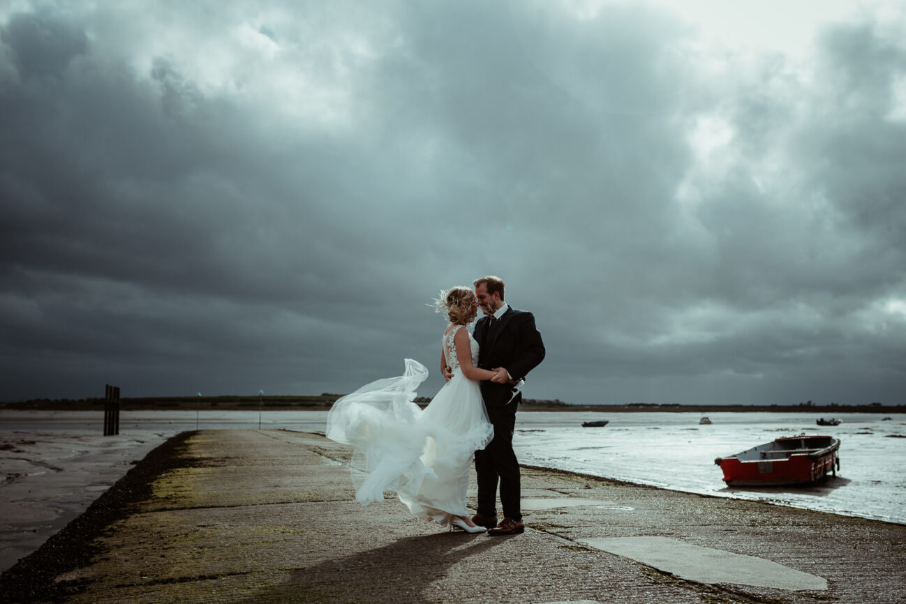 Bride and Groom on a windy beach in Leigh on Sea